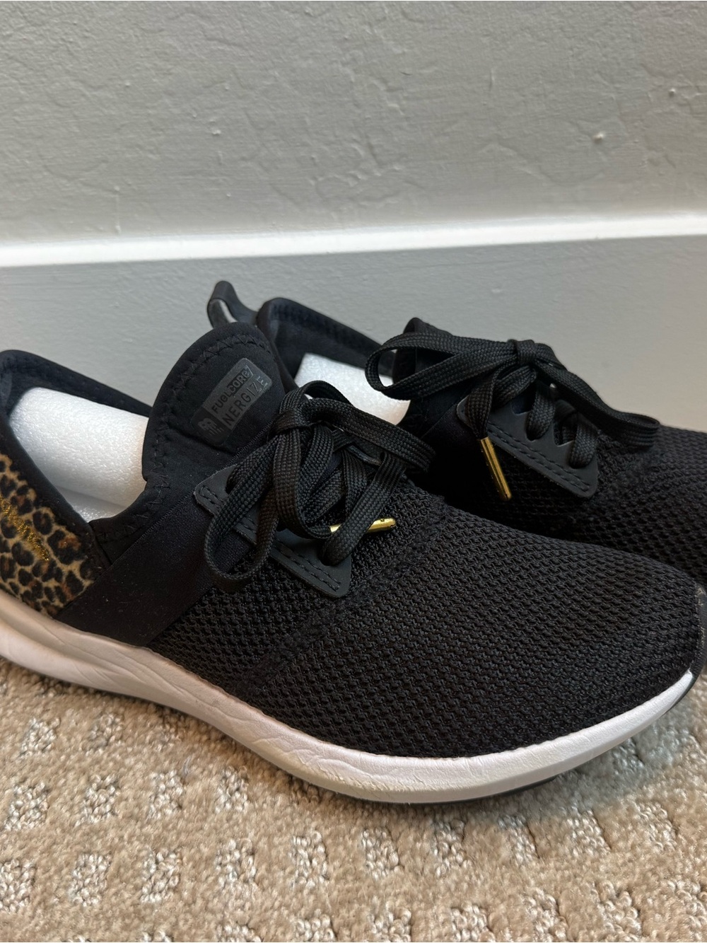 New Balance Black Sneakers with Leopard Accent and White Sole